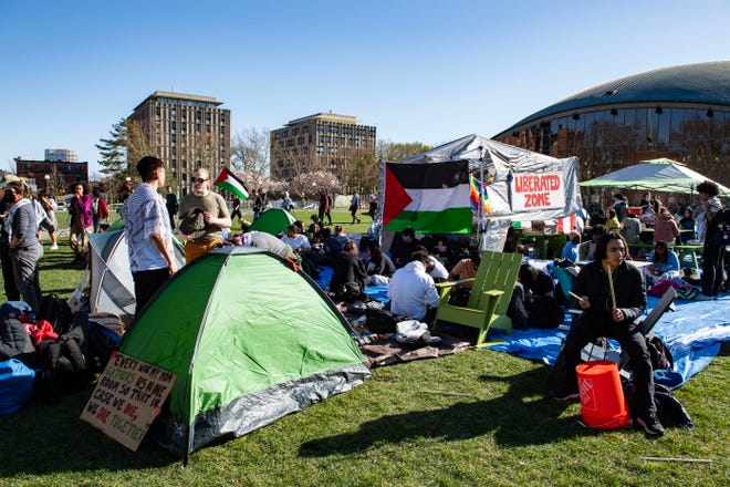 Pro-Palestinian supporters from Harvard University and the Massachusetts Institute of Technology (MIT) rally at MIT at an encampment in Cambridge, Mass., on April 22, 2024.