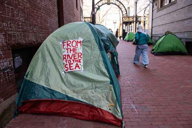Students at Emerson College supporting Palestine sleep in tents in an encampment in Boston on April 22, 2024. President Joe Biden condemned any anti-Semitism on college campuses on April 21, 2024, as pro-Palestinian protesters at Columbia University spent their fifth day demanding the school sever financial ties with U.S. ally Israel.