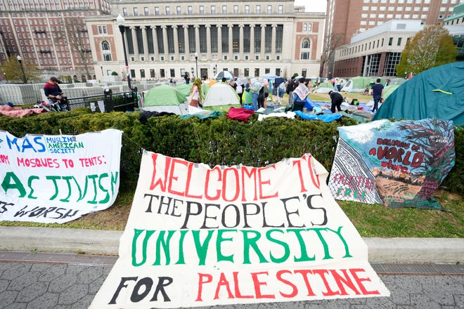 A sign which reads, "Welcome to the People's University for Palestine" is shown just outside the encampment, on the campus of Columbia University on April 24, 2024, in New York City.