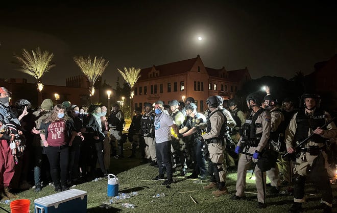 A pro-Palestinian protester is arrested on the Arizona State University Tempe campus shortly after midnight on April 27, 2024, after several hours of demonstrations.
